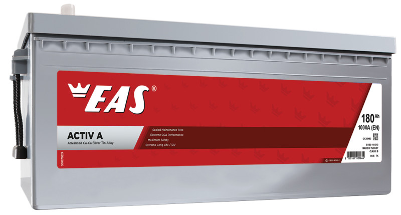 Desk with leather desk pad, walnut desk organizer, wireless keyboard and mouse, and porcelain mug.